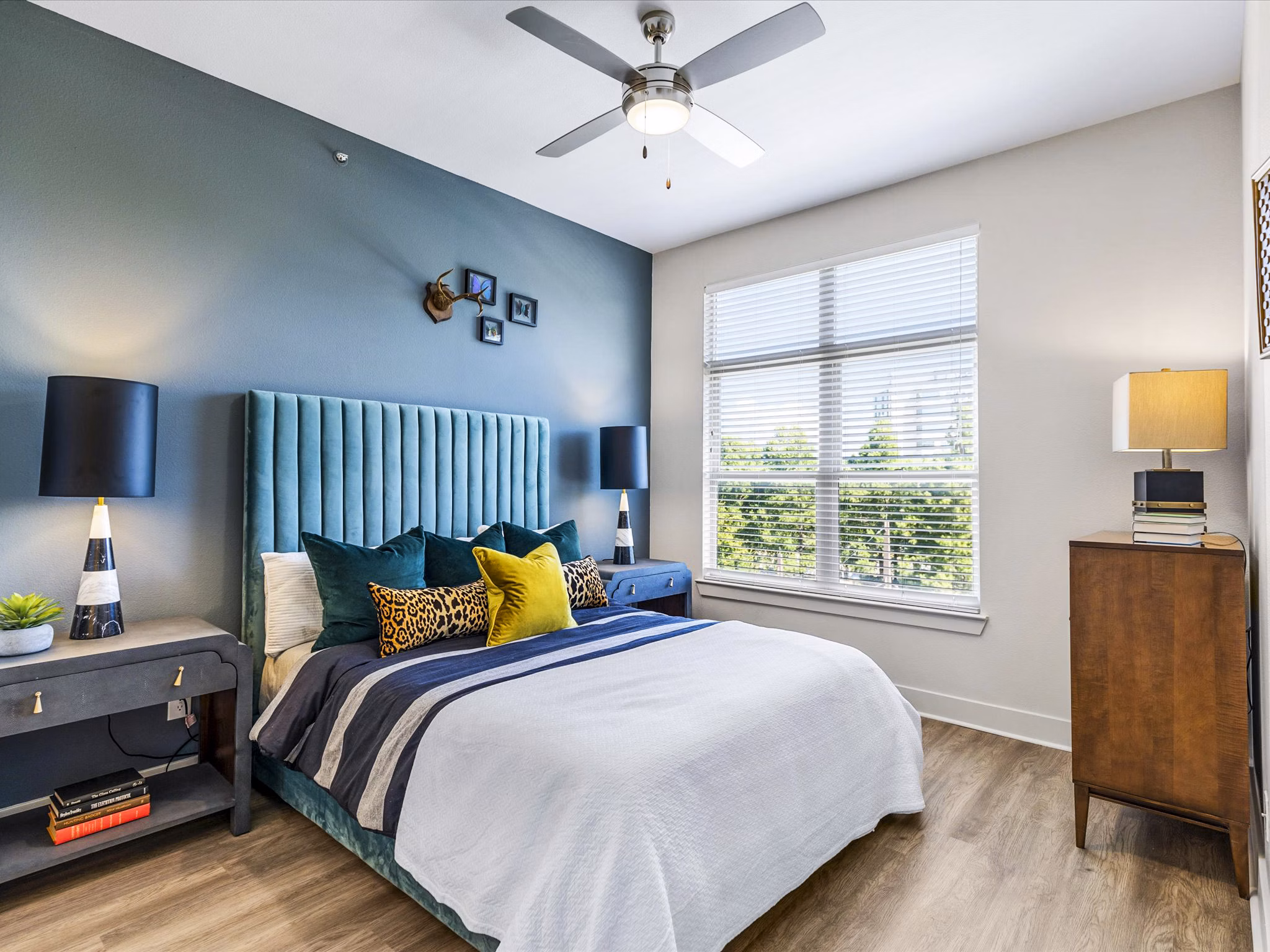 Cozy bedroom with stylish decor at Ambrose Apartments, Greystar's luxury living space in prime location