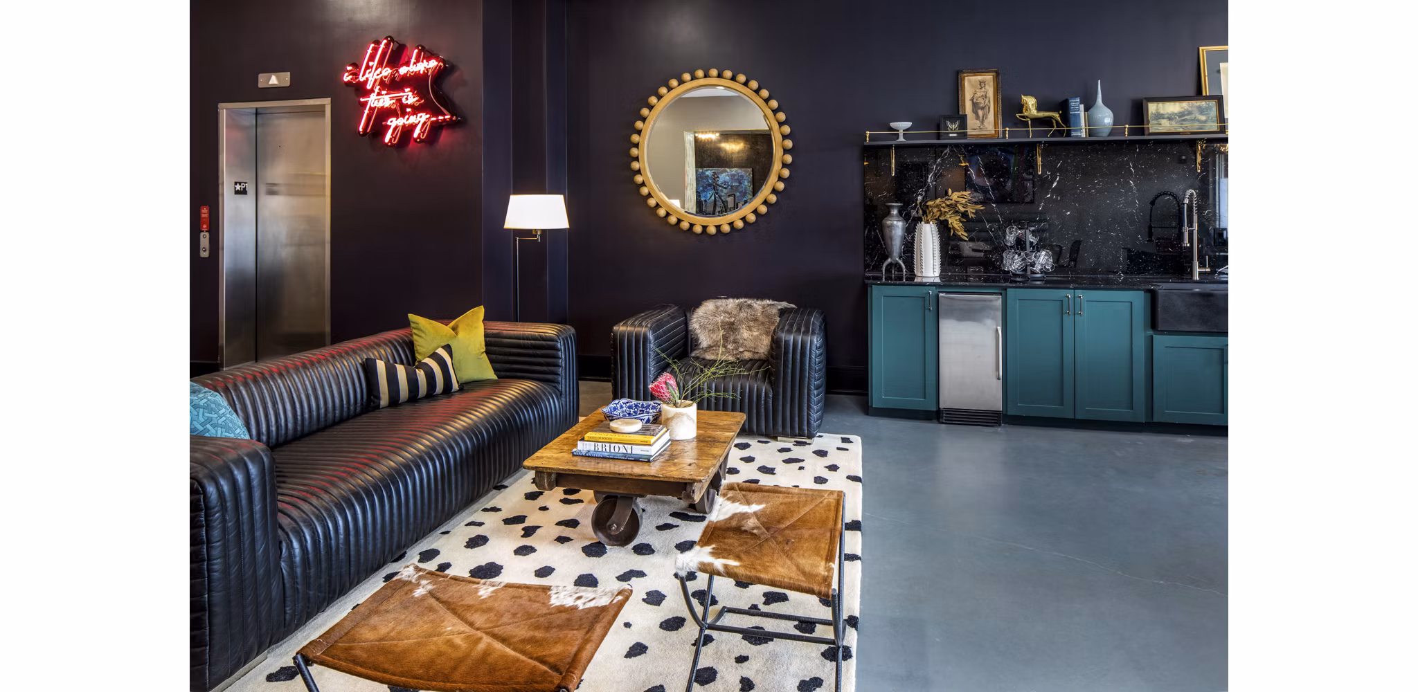 Modern clubhouse with stylish seating and game area at Broadstone Ambrose Apartments