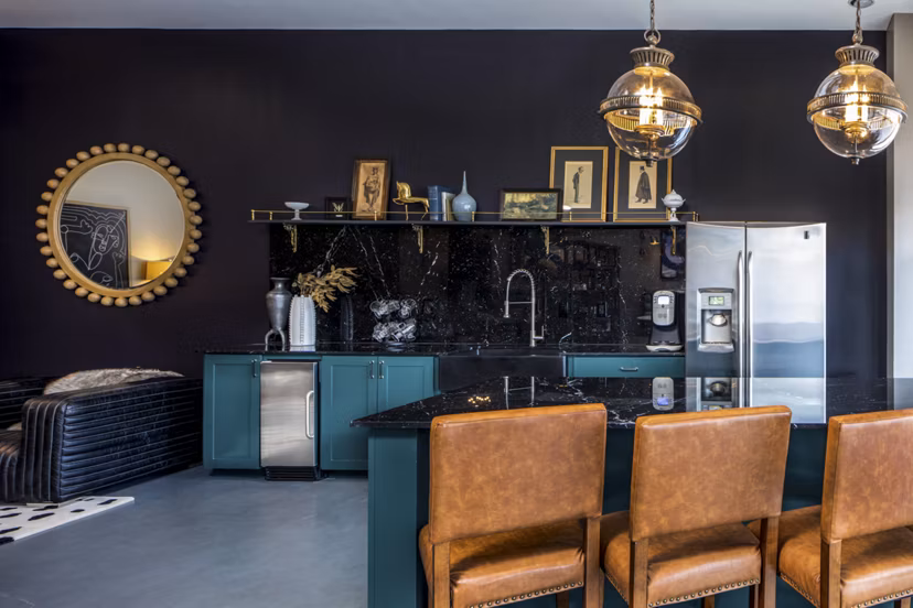 Broadstone Ambrose Apartments: Modern clubhouse with seating areas and pool table, offering luxury amenities in a vibrant community