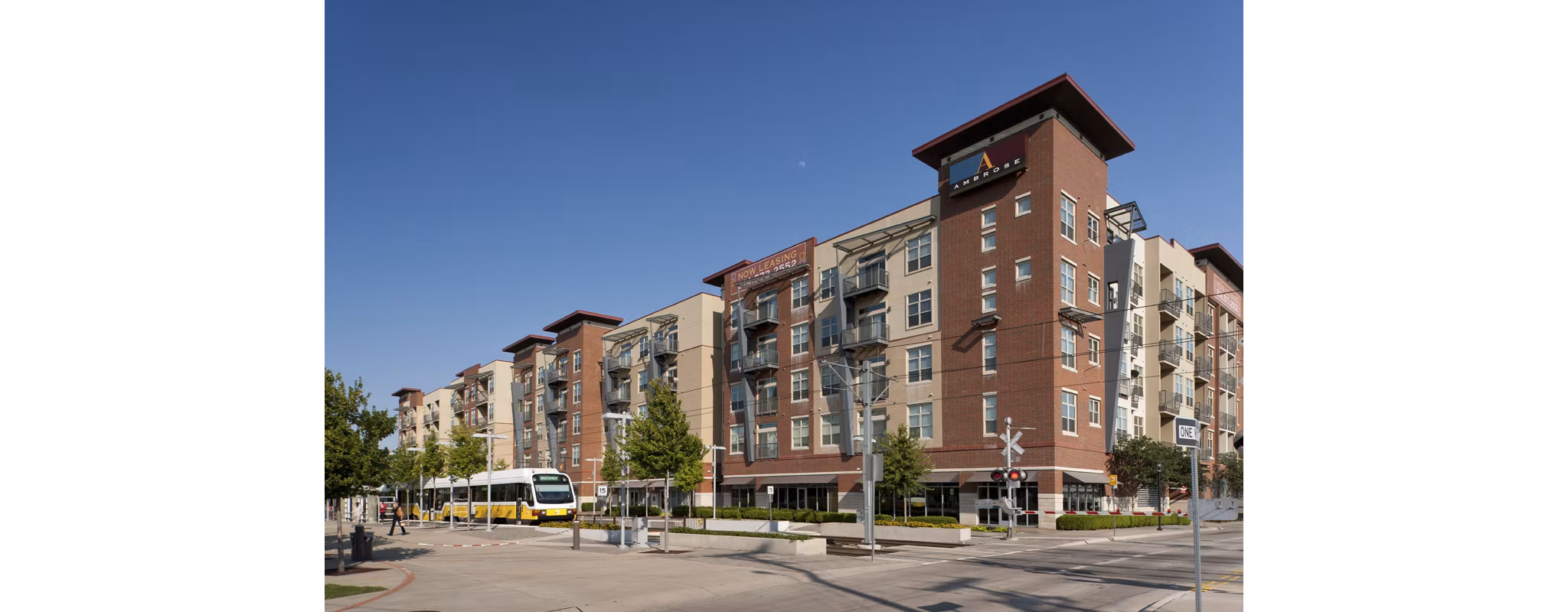 Neighborhood view at Broadstone Ambrose Apartments featuring tree-lined streets and modern architecture