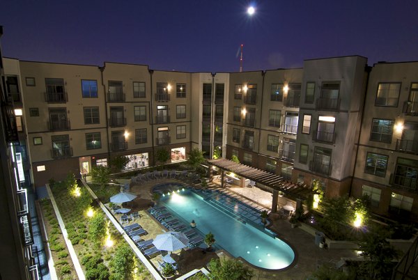 Luxe poolside retreat at Broadstone Ambrose Apartments with cabanas and sun loungers