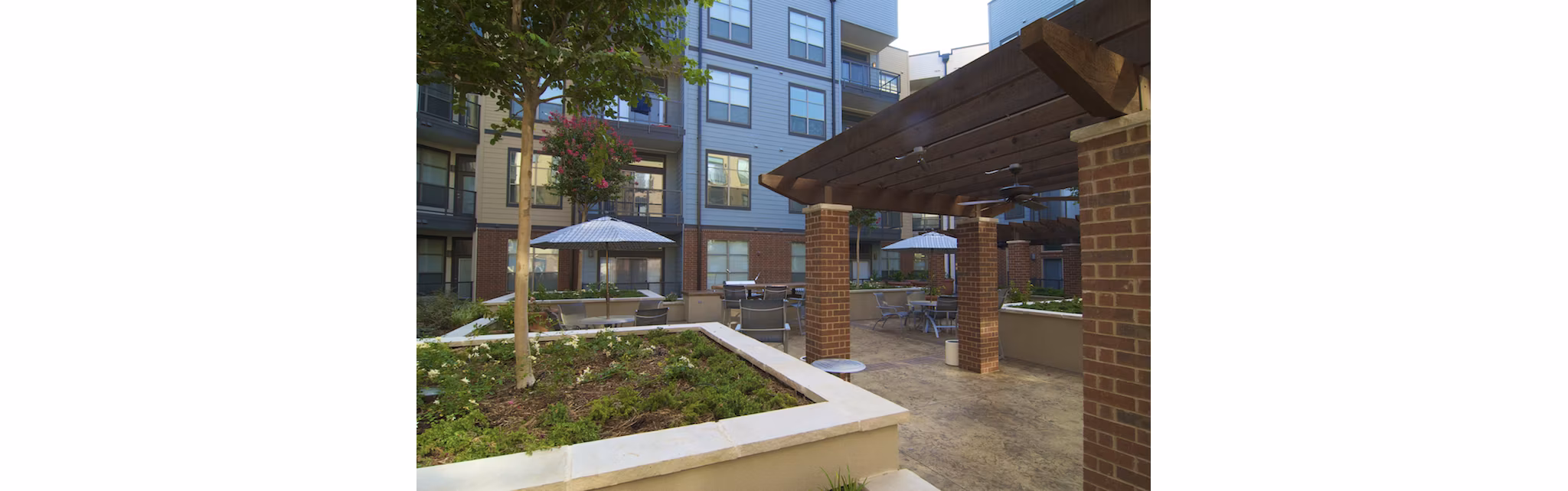 Grill area with modern seating at Broadstone Ambrose Apartments, a Greystar luxury community