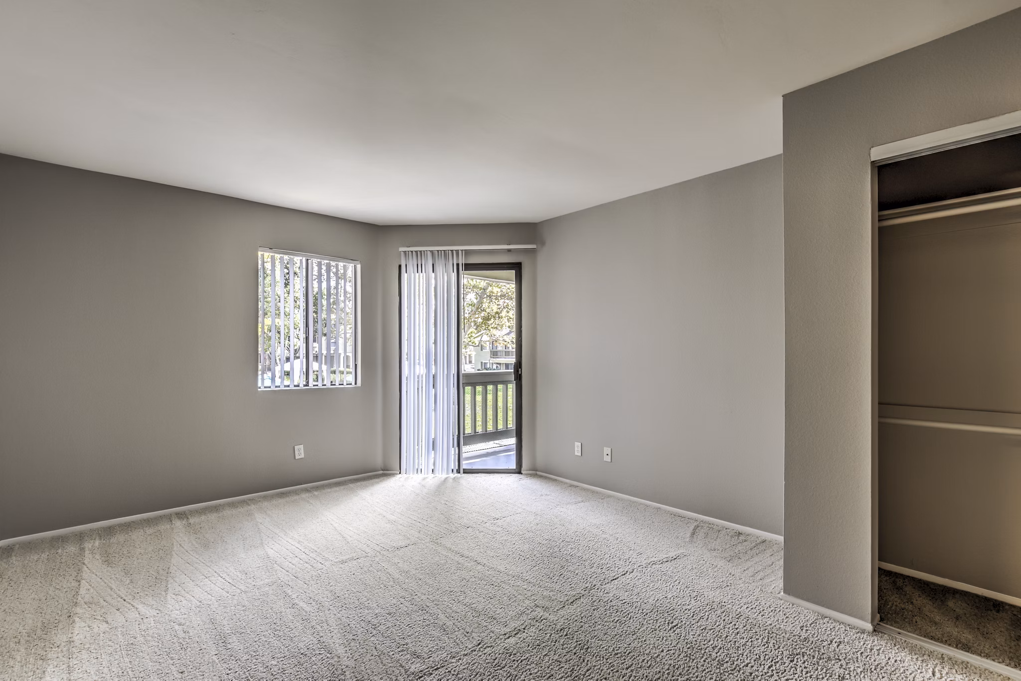 Elegant bedroom with plush bedding at Flower Fields Apartments, a Greystar luxury community