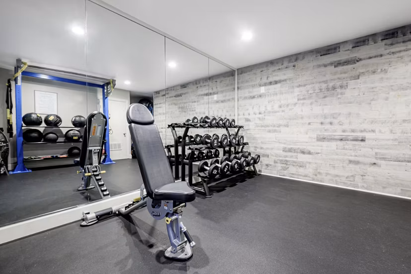 Fitness center featuring state-of-the-art equipment at Flower Fields Apartments, a luxury community with top amenities