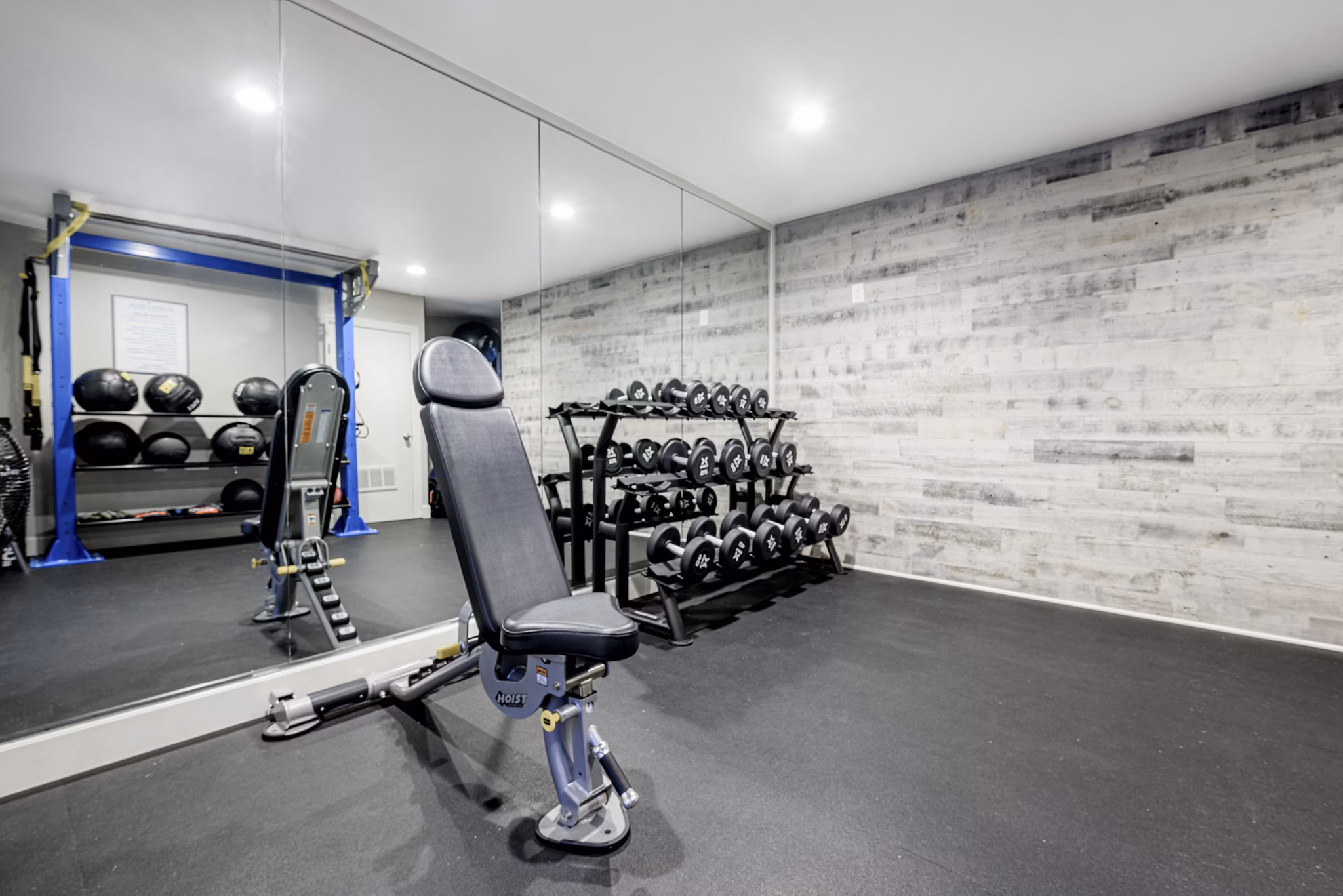 Fitness center featuring state-of-the-art equipment at Flower Fields Apartments, a luxury community with top amenities