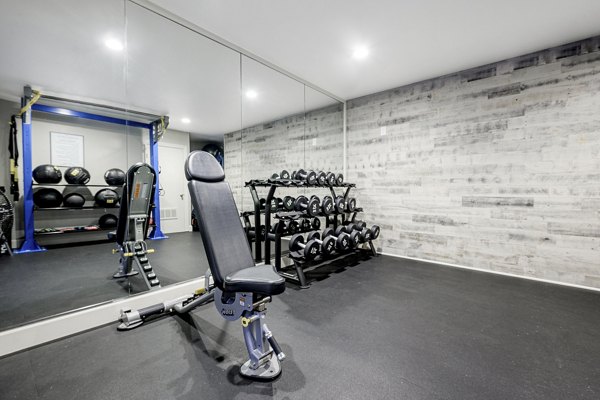 Fitness center featuring state-of-the-art equipment at Flower Fields Apartments, a luxury community with top amenities