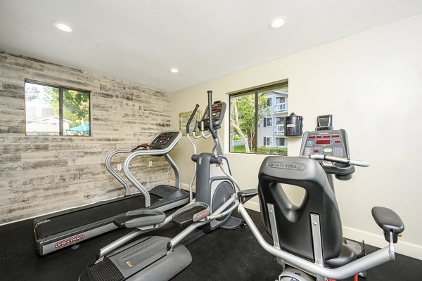 Fitness center with modern equipment at Flower Fields Apartments for an active lifestyle