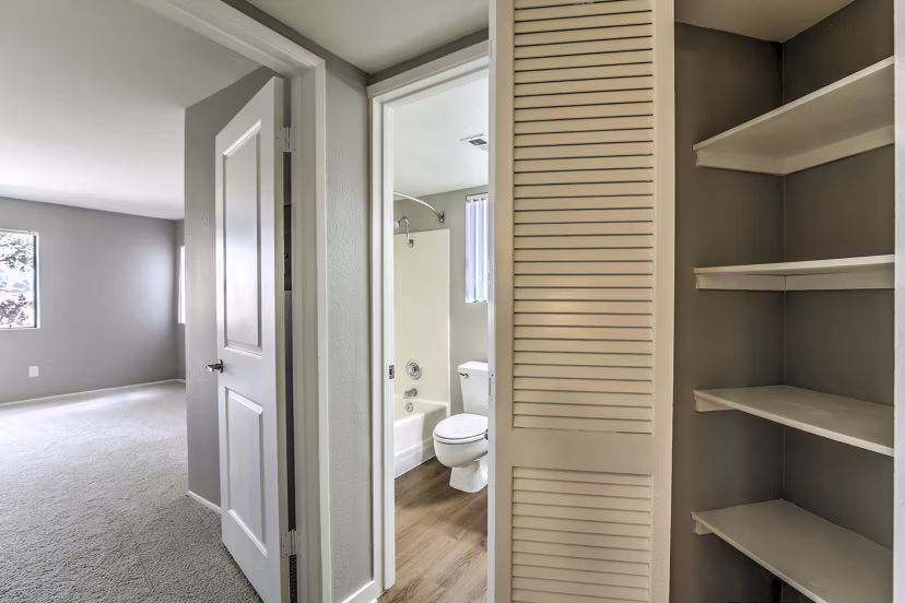 Elegant hallway with contemporary lighting at Flower Fields Apartments, showcasing luxury living
