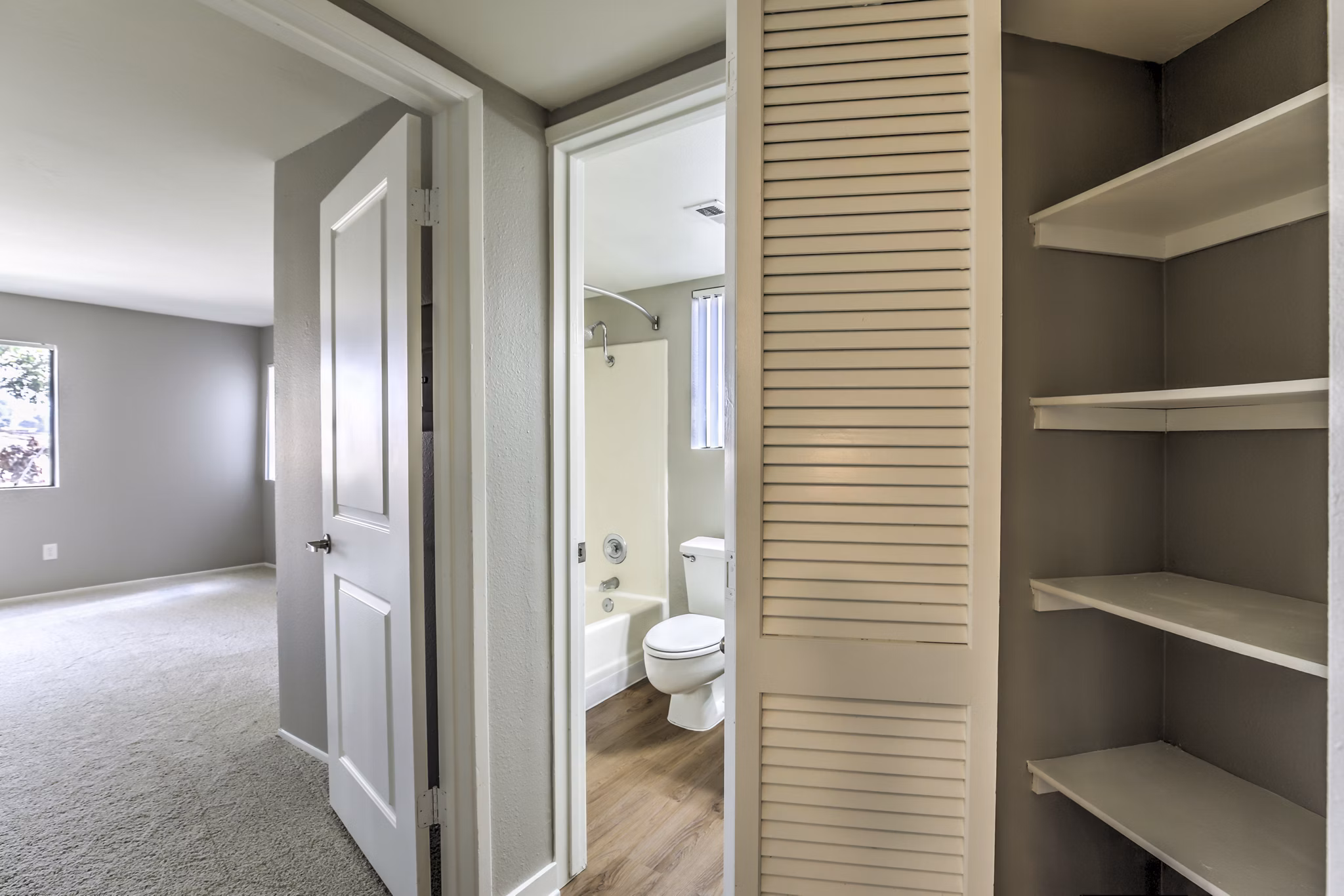 Elegant hallway with contemporary lighting at Flower Fields Apartments, showcasing luxury living