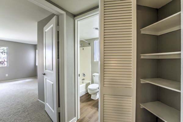 Elegant hallway with contemporary lighting at Flower Fields Apartments, showcasing luxury living