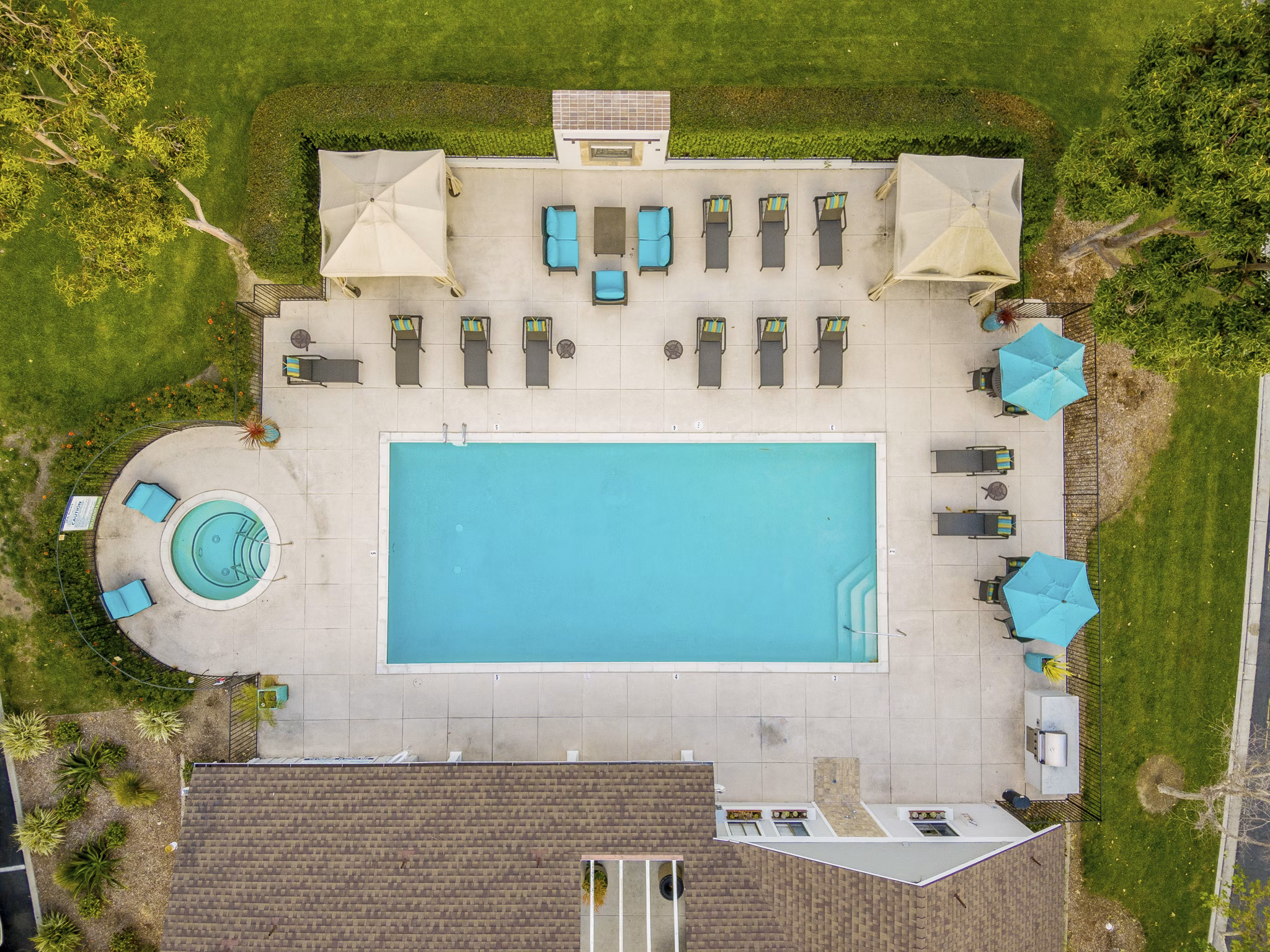 Pool with sundeck at Flower Fields Apartments, a luxury property by Greystar in a serene landscape