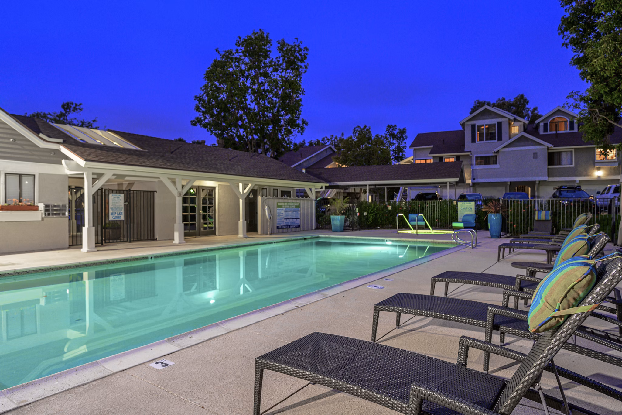 Resort-style pool at Flower Fields Apartments offering luxury amenities and relaxation spaces
