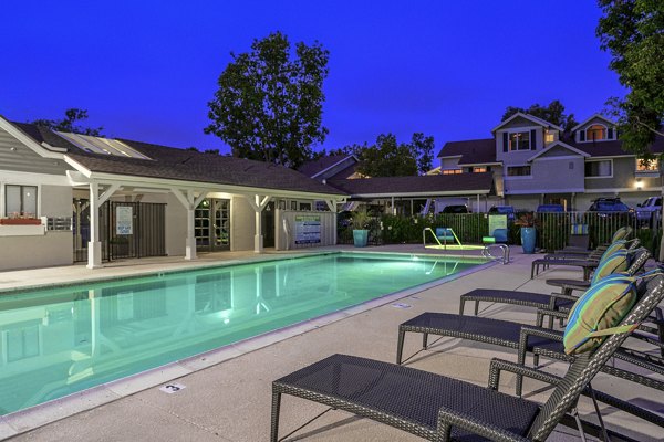 Resort-style pool at Flower Fields Apartments offering luxury amenities and relaxation spaces