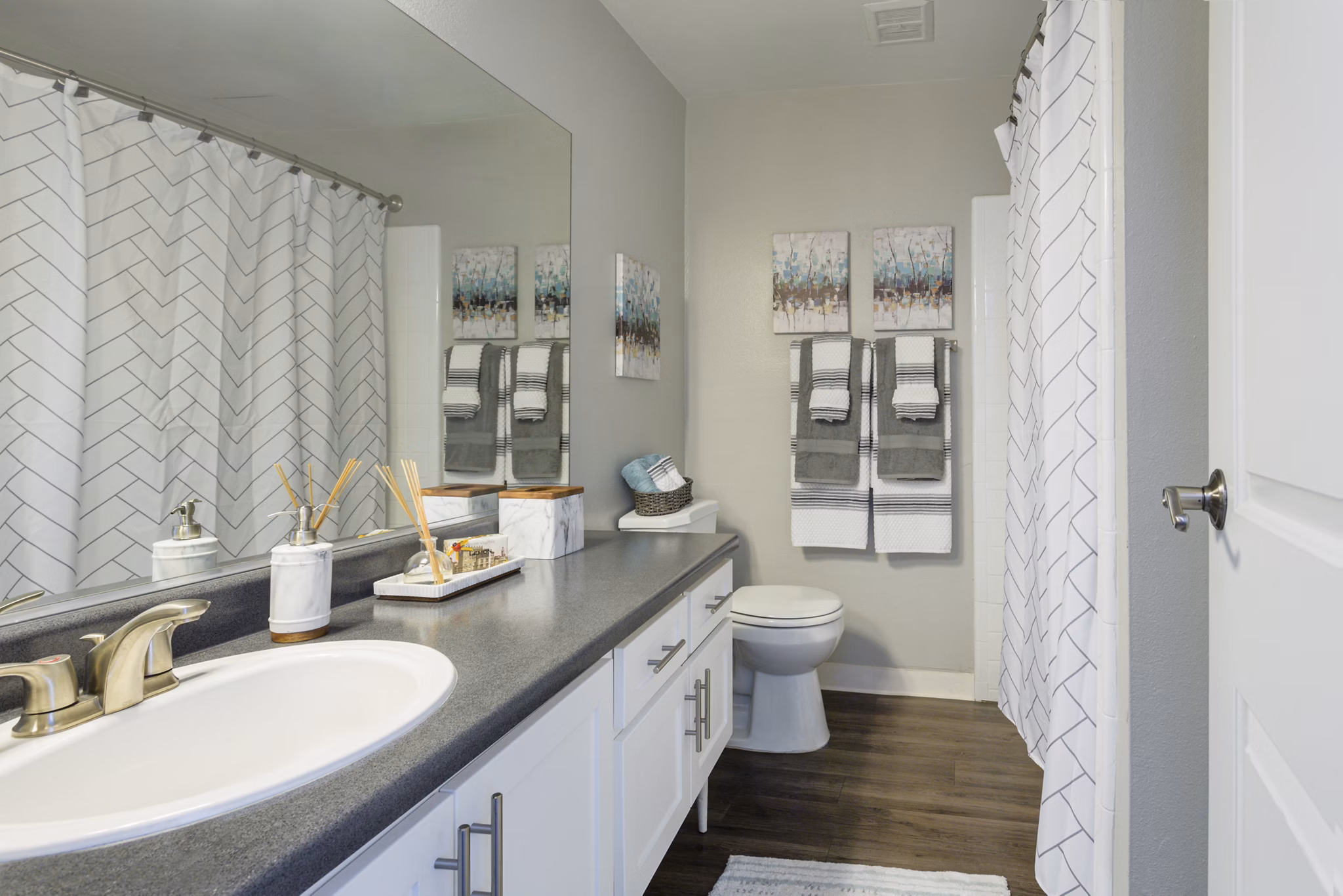 Bathroom at 1200 Riverside Apartments featuring sleek fixtures and modern design