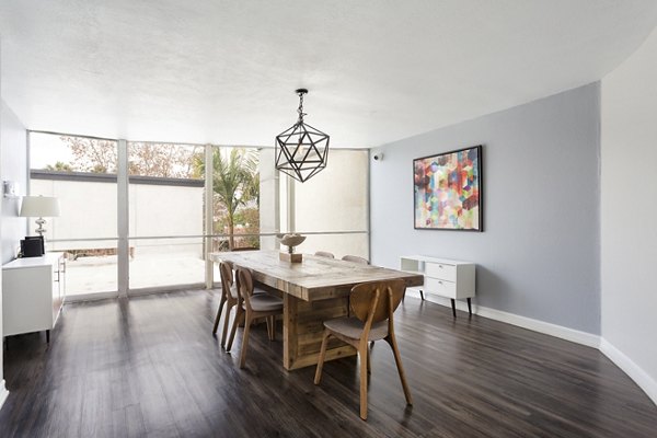 Modern clubhouse with plush seating and pool table at 1200 Riverside Apartments