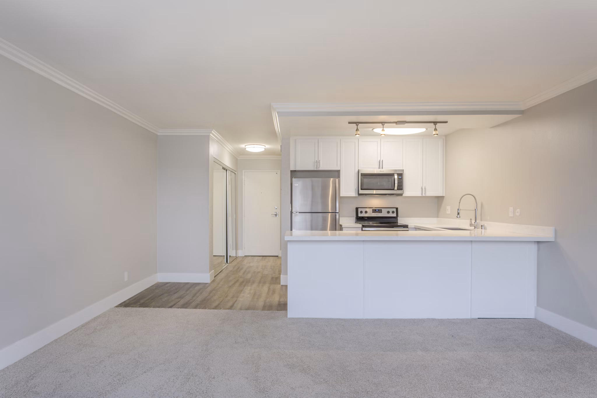 Modern kitchen featuring stainless steel appliances at 1200 Riverside Apartments in luxury Greystar property