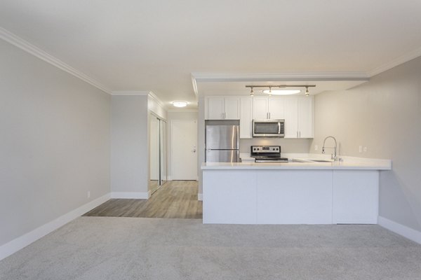 Modern kitchen featuring stainless steel appliances at 1200 Riverside Apartments in luxury Greystar property