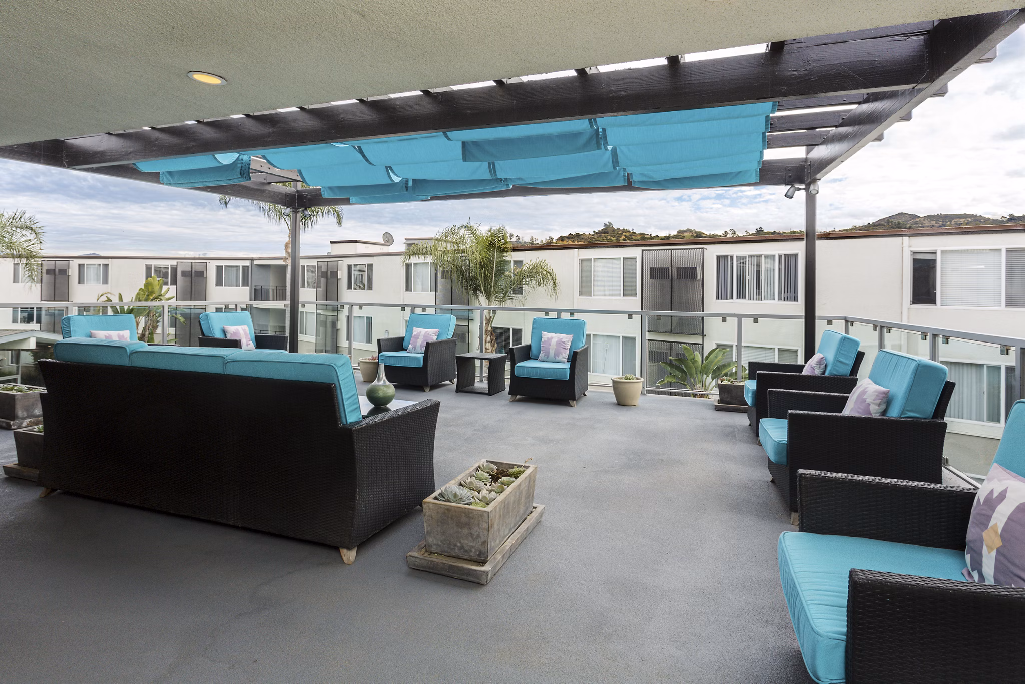 Rooftop deck with city skyline views at 1200 Riverside Apartments