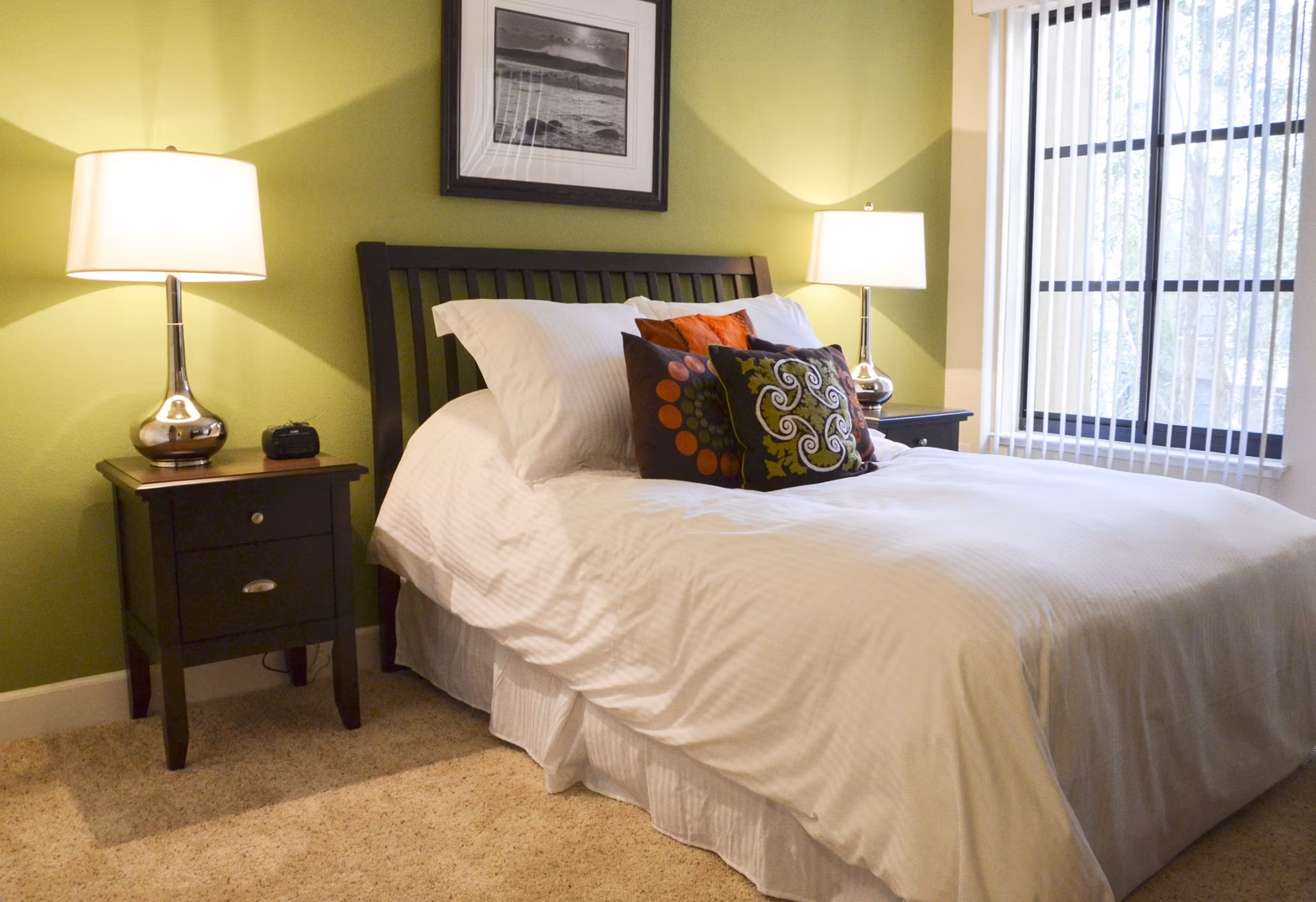 The Windsor Apartments: Modern bedroom with elegant furnishings and large windows for luxury living