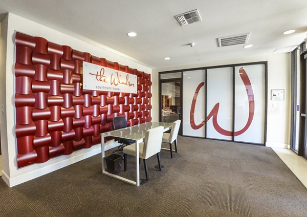 Elegant clubhouse with modern furnishings at The Windsor Apartments, ideal for gatherings and events in a luxury community setting