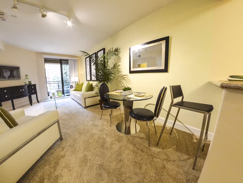 Dining area featuring elegant furnishings and modern lighting at The Windsor Apartments