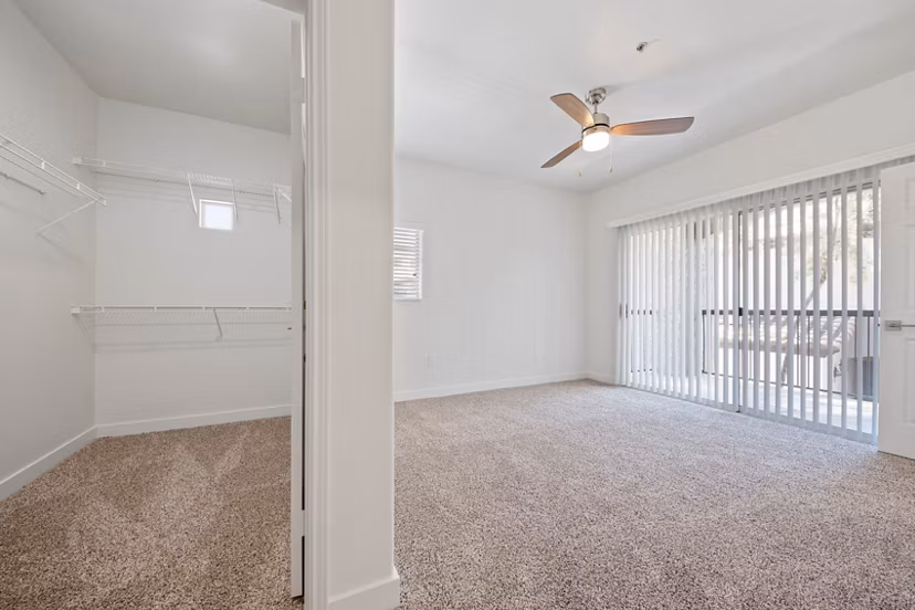 Spacious living room with contemporary decor in GlenEagles Apartments, a luxury property by Greystar