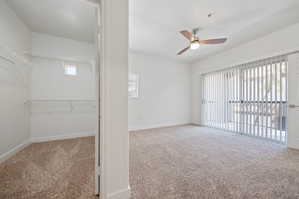 Spacious living room with contemporary decor in GlenEagles Apartments, a luxury property by Greystar