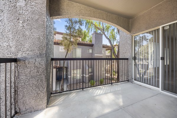 Private patio with outdoor seating at GlenEagles Apartments, ideal for relaxation and enjoying scenic views