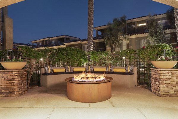 Fire pit on modern patio at GlenEagles Apartments, offering a luxurious outdoor experience