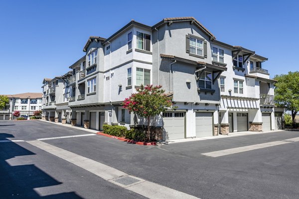 Luxury apartment complex with multiple units and garages in a modern residential setting
