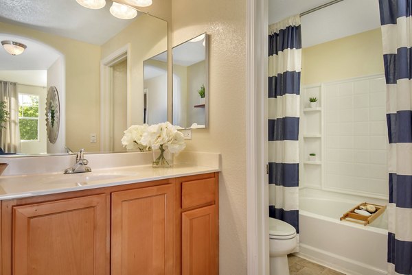 Modern bathroom with sleek fixtures and ample storage space at Montessa At Whitney Ranch Apartments