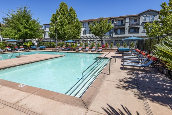 Resort-style pool area at Montessa at Whitney Ranch Apartments offering luxurious relaxation and recreation amenities