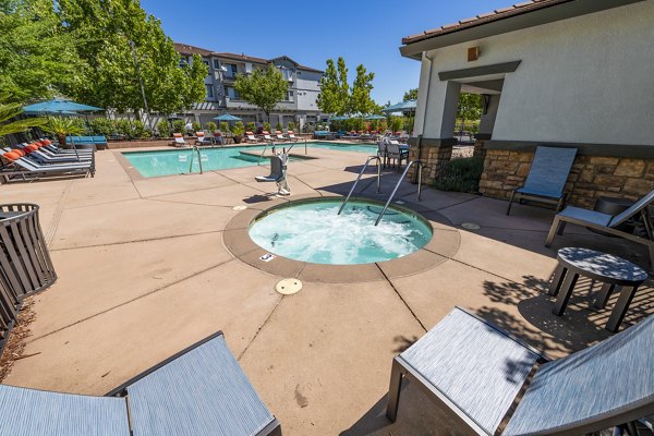 Relaxing hot tub at Montessa at Whitney Ranch Apartments offering luxury amenities for ultimate comfort and leisure