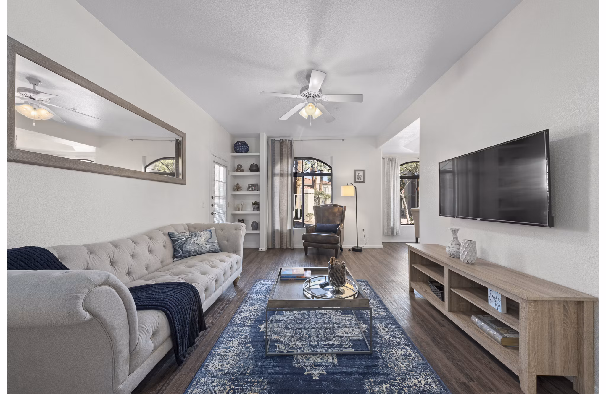 Spacious living room with modern decor in San Cierra Apartments, providing luxury living by Greystar