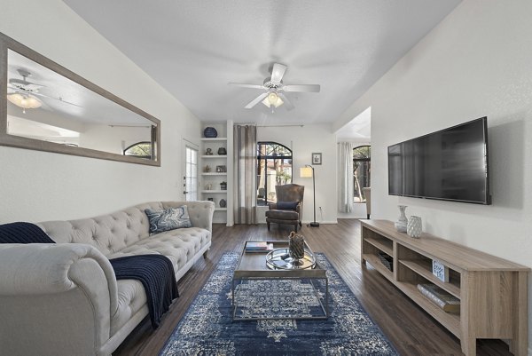 Spacious living room with modern decor in San Cierra Apartments, providing luxury living by Greystar