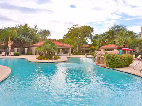 Resort-style pool with cabanas at San Cierra Apartments