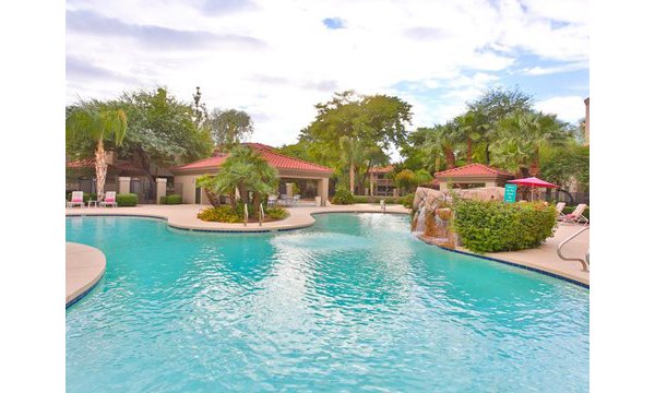 Resort-style pool with cabanas at San Cierra Apartments