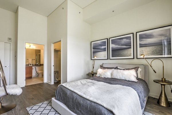 NoHo 14 Apartments: Modern bedroom with sleek furnishings in luxury Greystar apartments