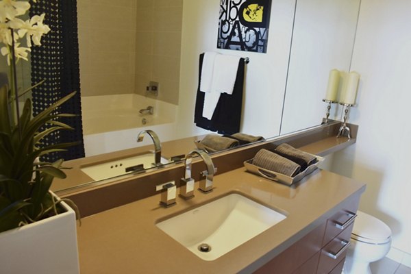 Luxurious bathroom with modern fixtures at NoHo 14 Apartments, offering a stylish living experience in the heart of the city