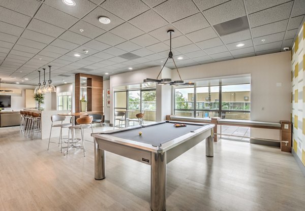 Contemporary clubhouse featuring stylish seating and modern decor at NoHo 14 Apartments