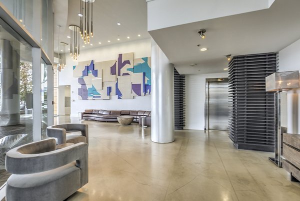 Clubhouse featuring modern decor and seating at NoHo 14 Apartments