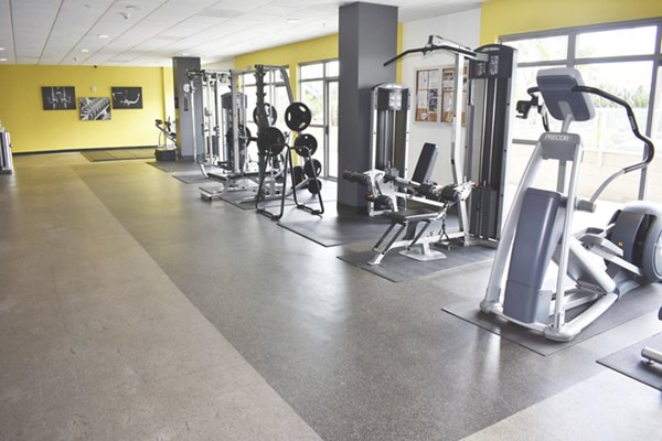 Fitness center with modern equipment at NoHo 14 Apartments