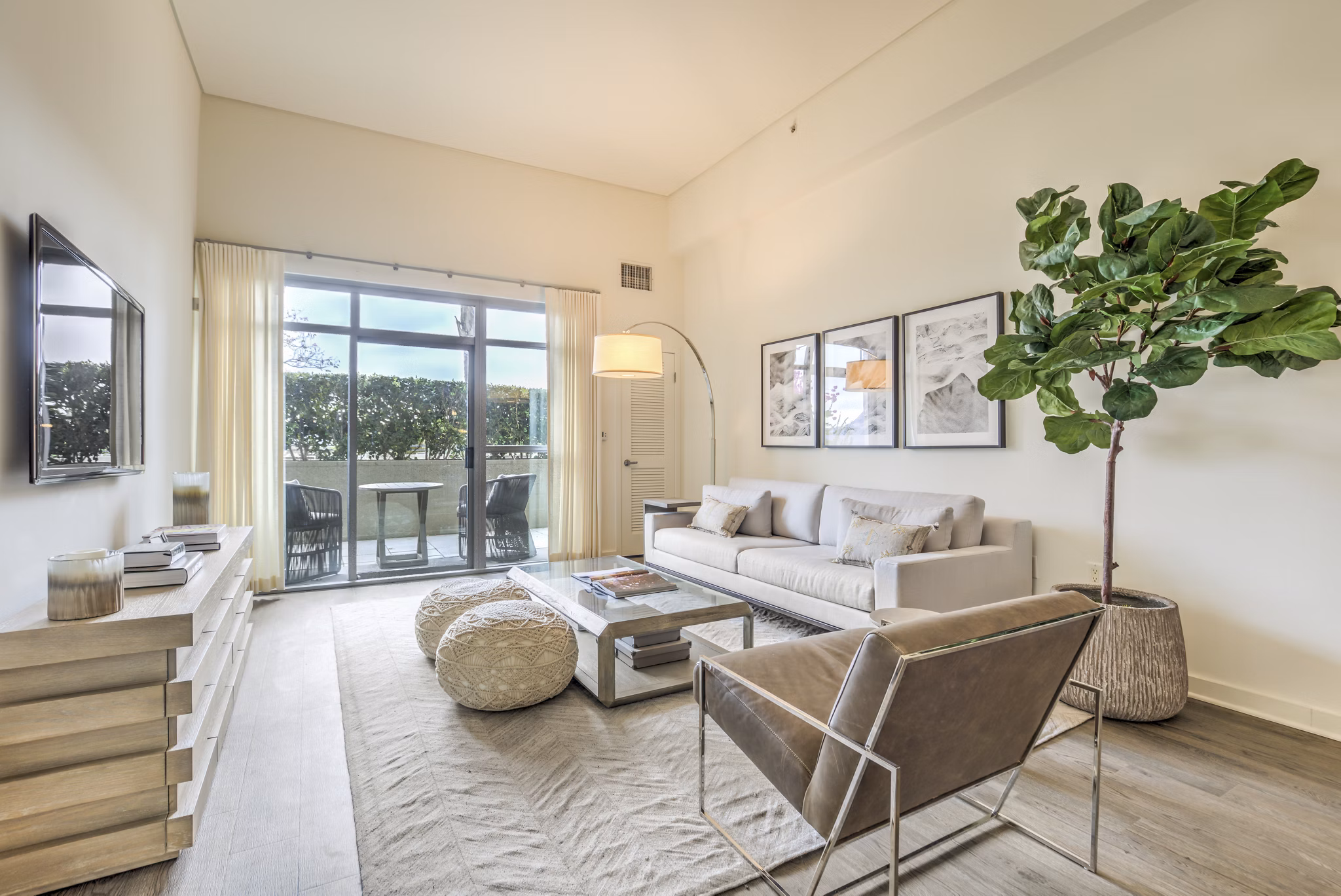 Spacious living room with contemporary decor in NoHo 14 Apartmentsâ€‹