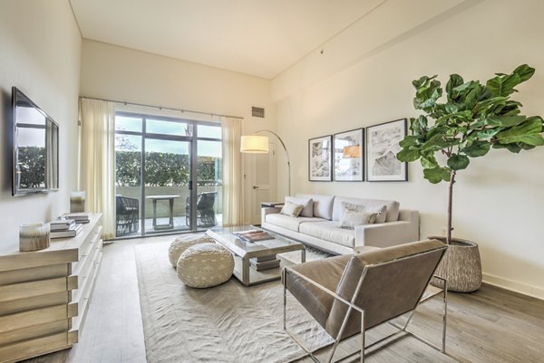 Spacious living room with contemporary decor in NoHo 14 Apartmentsâ€‹