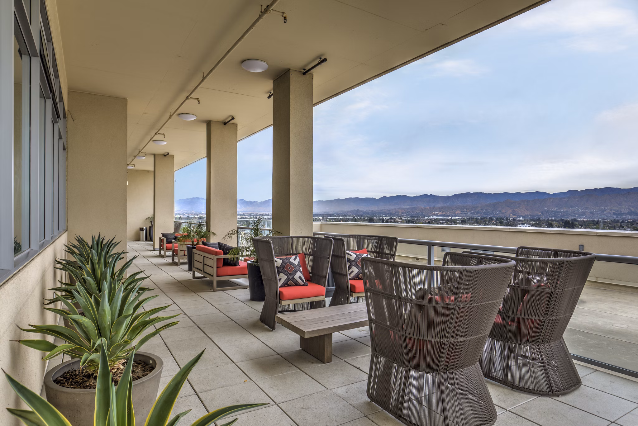 Patio with modern seating and city views at NoHo 14 Apartments luxury residences in North Hollywood