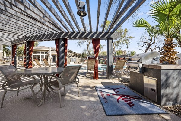 Grill area with seating at San Riva At The Foothills Apartments showing luxury outdoor living space