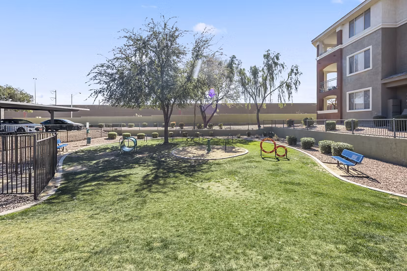 Colorful playground equipment at San Riva At The Foothills Apartments, ideal for family fun and outdoor play in a scenic community setting