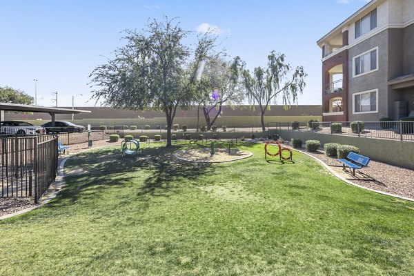 Colorful playground equipment at San Riva At The Foothills Apartments, ideal for family fun and outdoor play in a scenic community setting