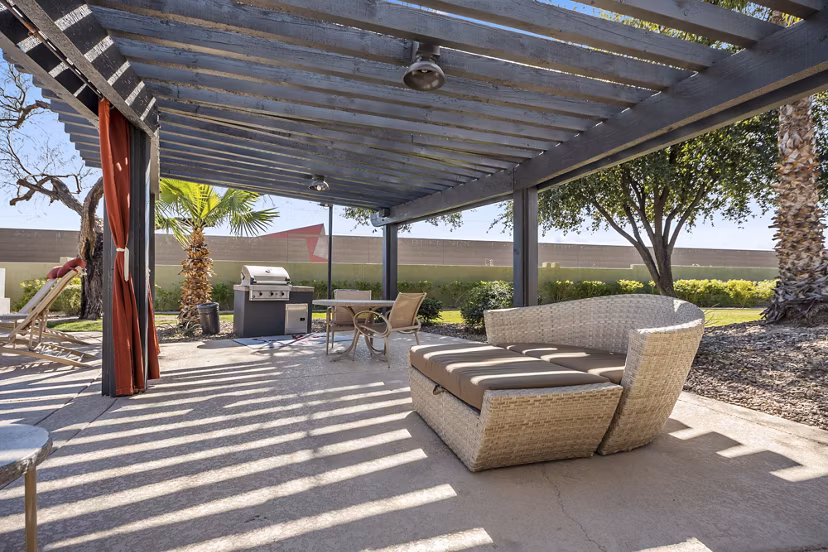 Grill area at San Riva at the Foothills Apartments with modern barbecue stations and outdoor seating Ideal for hosting gatherings