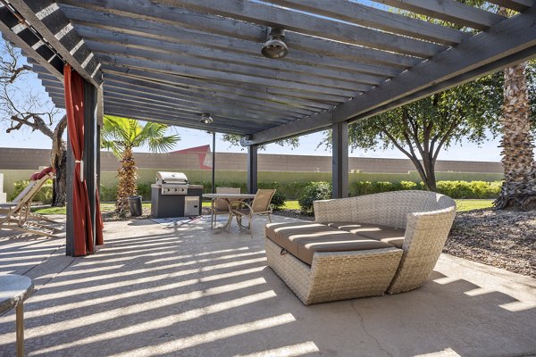 Grill area at San Riva at the Foothills Apartments with modern barbecue stations and outdoor seating Ideal for hosting gatherings
